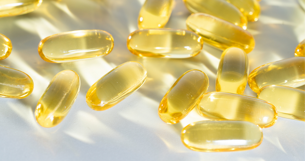 Bright yellow gel tab capsules that look like Fish Oil Supplements