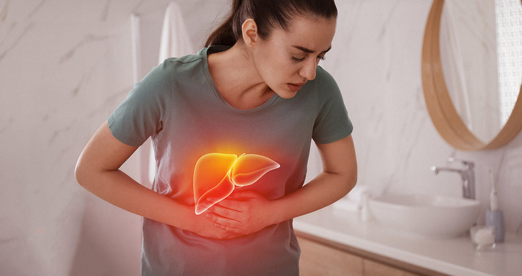 Woman holding her abdomen with a glowing orange liver icon overlay, indicating liver health concerns.