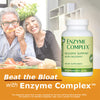 Happy couple eating vegetables with enzyme supplement