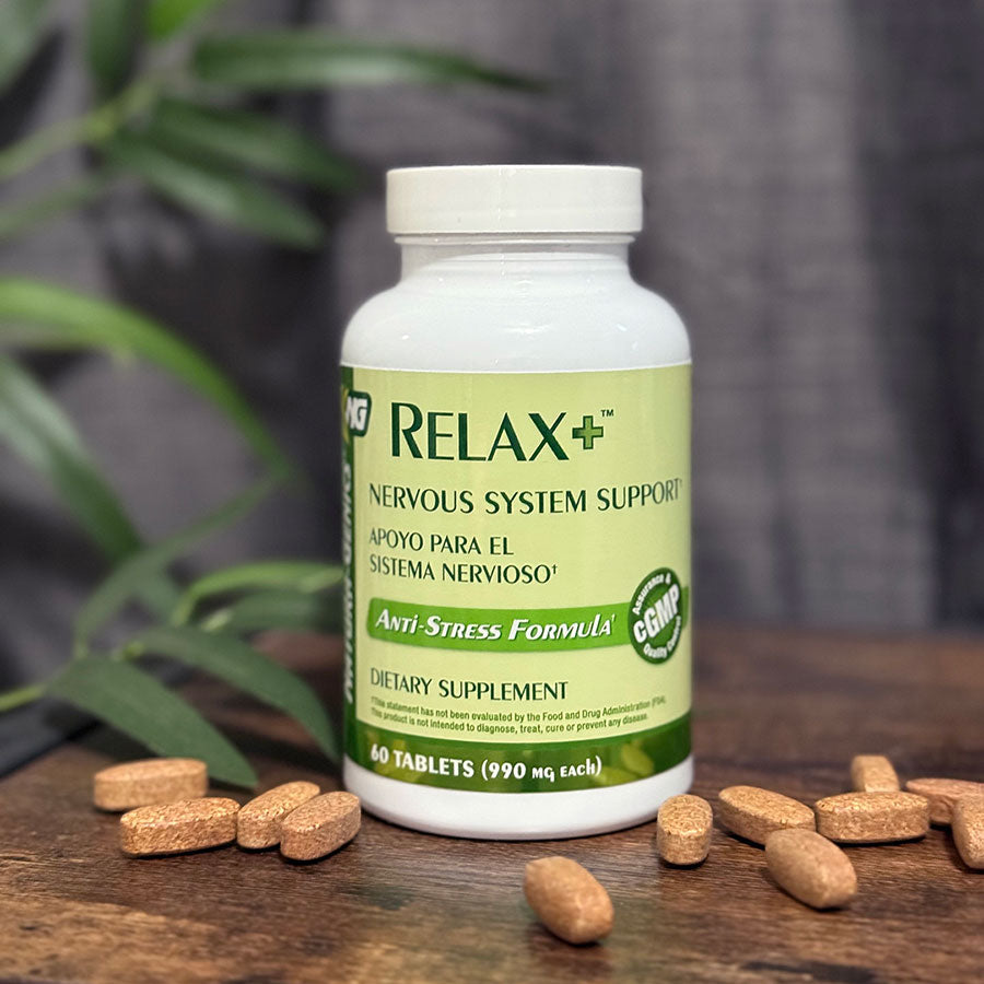 Bottle of relax supplement with tablets around it